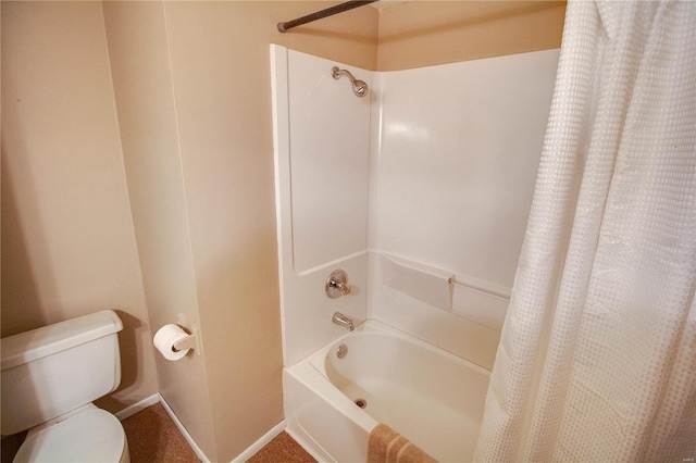 bathroom with toilet and shower / tub combo with curtain