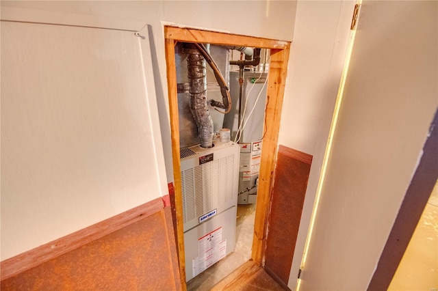 utility room with water heater