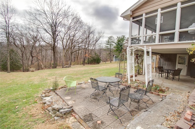 view of patio / terrace with a sunroom