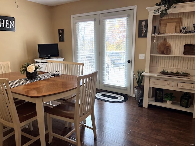 dining area with dark wood-type flooring