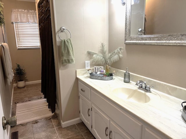 bathroom with tile patterned flooring and vanity