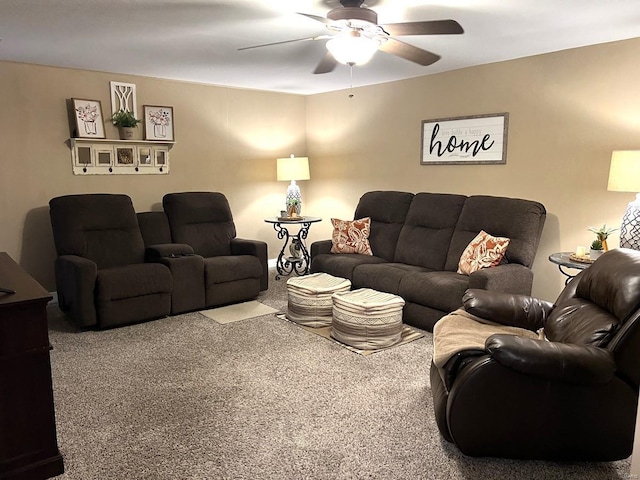 living room featuring ceiling fan and carpet