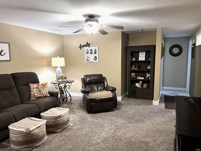 living room with carpet and ceiling fan