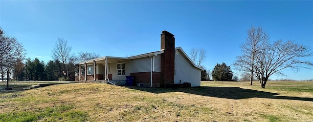 view of property exterior with a yard