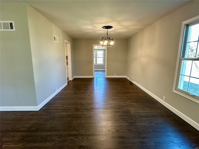 unfurnished dining area with dark hardwood / wood-style floors