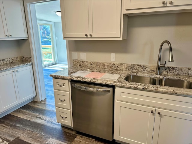 kitchen with dark hardwood / wood-style floors, dishwasher, sink, white cabinets, and light stone counters