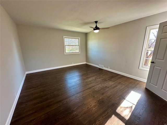 foyer entrance featuring dark wood-type flooring and ceiling fan