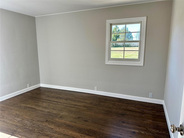 empty room with dark wood-type flooring