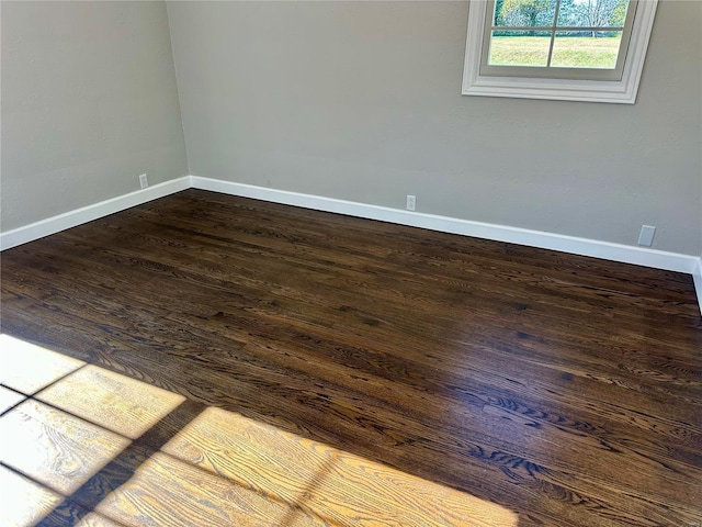 empty room featuring dark hardwood / wood-style floors