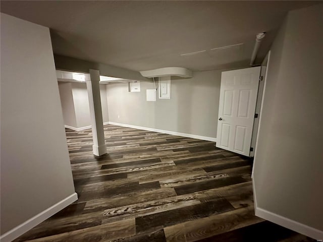 basement featuring dark wood-type flooring