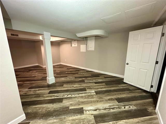 basement featuring dark wood-type flooring