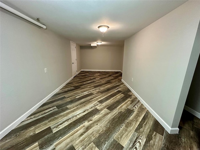 basement featuring dark hardwood / wood-style floors