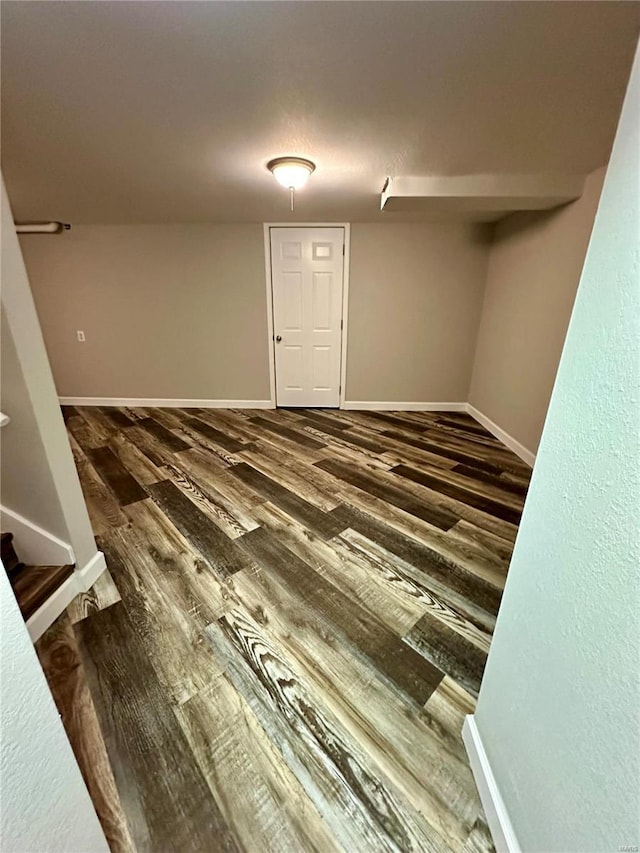 empty room featuring dark wood-type flooring