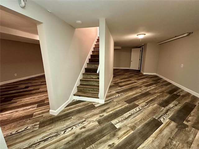 stairway featuring wood-type flooring