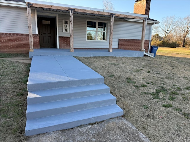 exterior space featuring a porch and a front yard