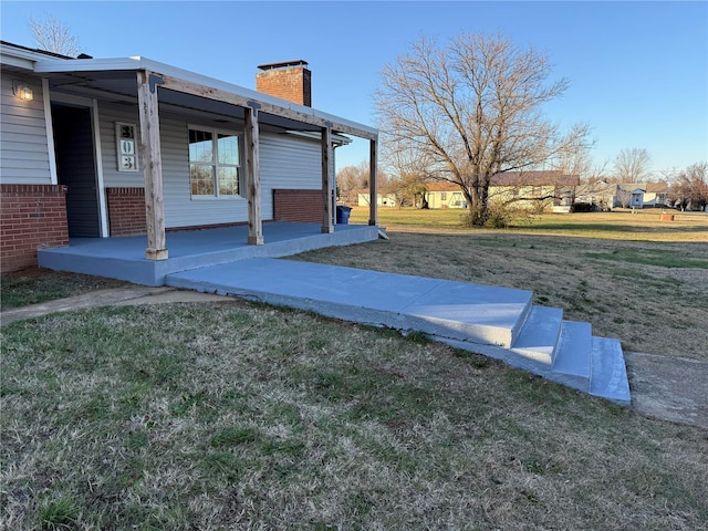 view of yard featuring covered porch