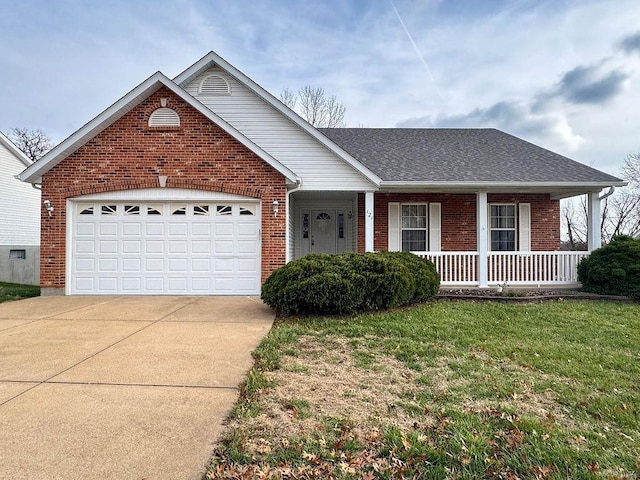 ranch-style house featuring covered porch, a garage, and a front yard