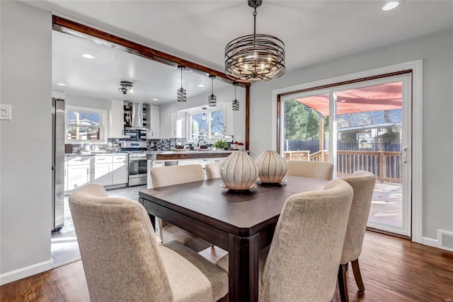 dining room featuring hardwood / wood-style floors and sink