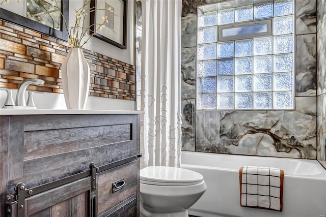 bathroom with a wealth of natural light and toilet