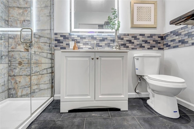 bathroom featuring tile patterned flooring, vanity, toilet, and an enclosed shower