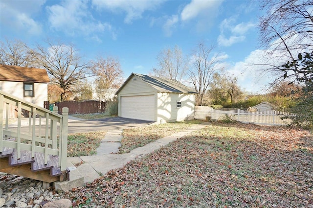 exterior space with an outbuilding and a garage