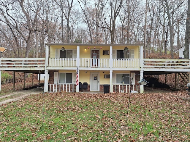 back of house with a wooden deck