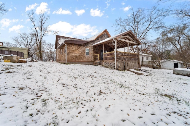 view of snow covered house