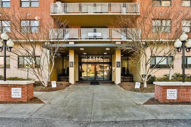 view of exterior entry featuring french doors