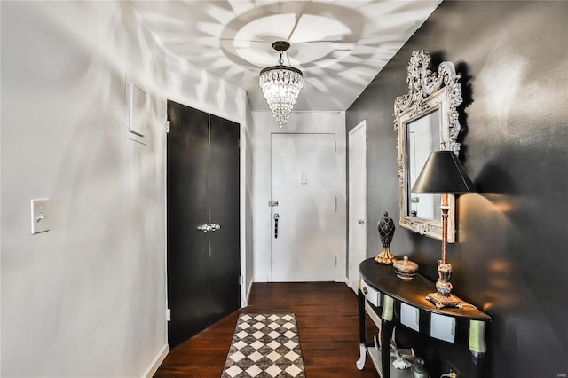 interior space with dark hardwood / wood-style flooring and an inviting chandelier