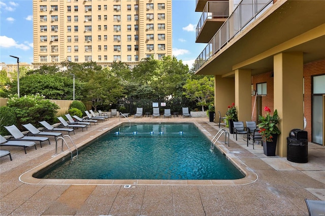 view of swimming pool featuring a patio area