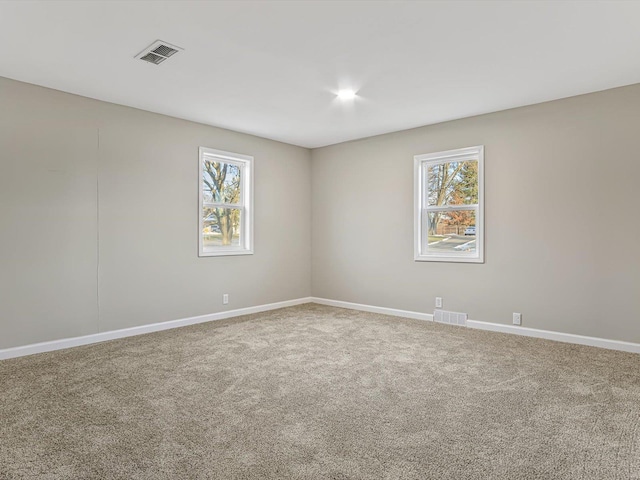 unfurnished room featuring carpet floors