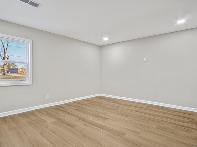 unfurnished room with light hardwood / wood-style flooring