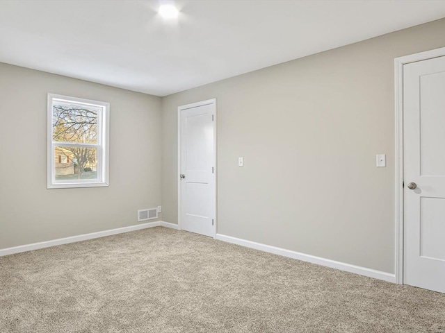 empty room with carpet flooring