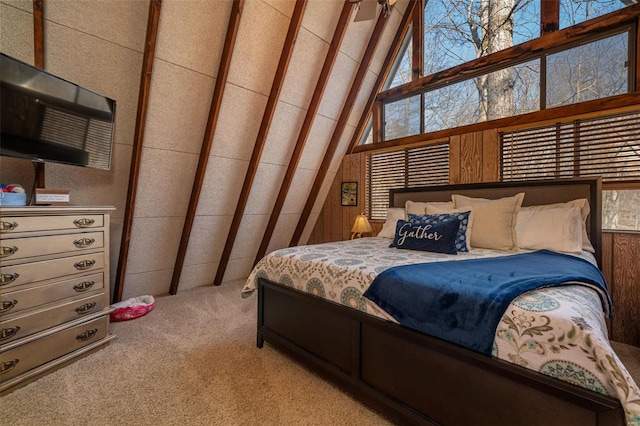 bedroom with light carpet and high vaulted ceiling