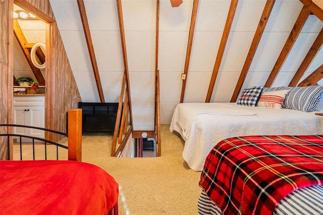 bedroom featuring carpet and vaulted ceiling