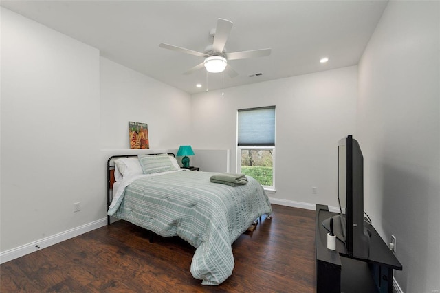 bedroom featuring ceiling fan and dark hardwood / wood-style floors