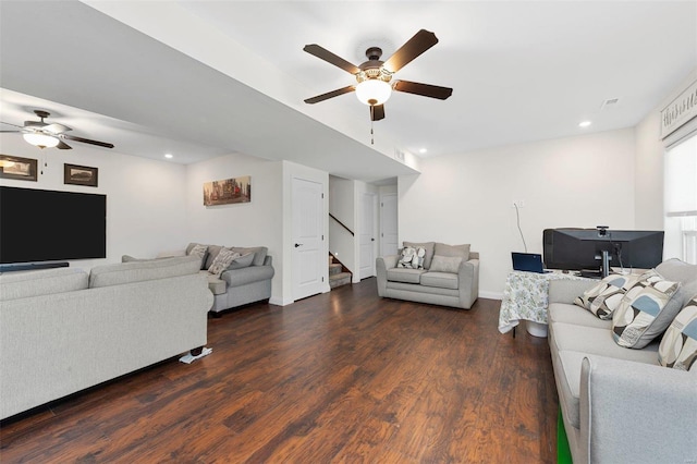 living room with ceiling fan and dark hardwood / wood-style flooring