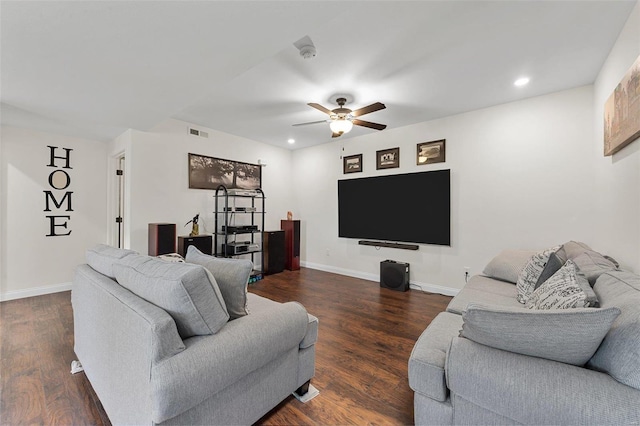 living room featuring dark hardwood / wood-style flooring and ceiling fan