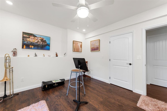 miscellaneous room with ceiling fan and dark wood-type flooring