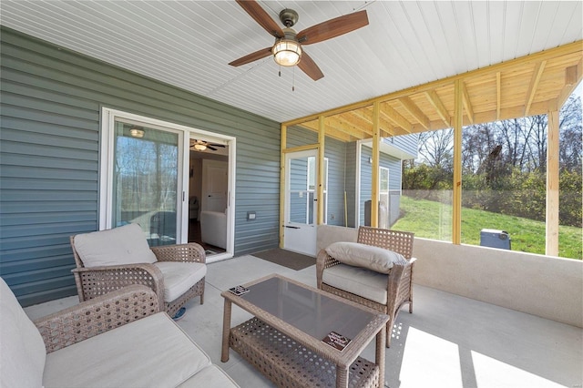 sunroom / solarium with ceiling fan