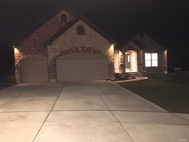 view of front of home with a garage