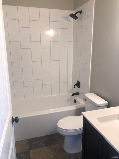 full bathroom with vanity, toilet, and tiled shower / bath