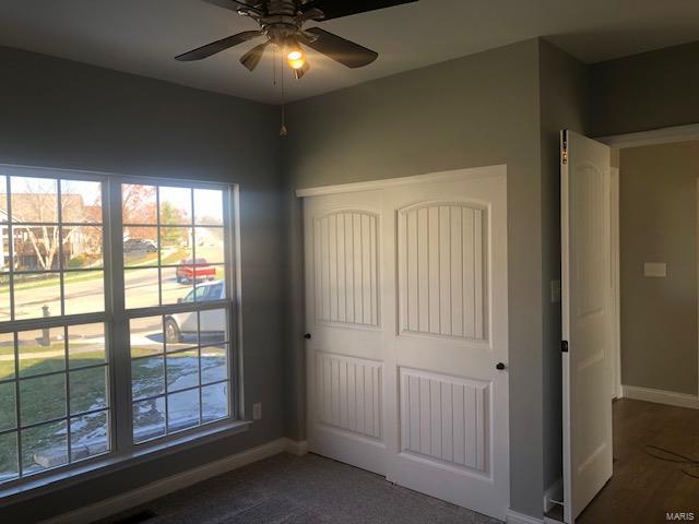 unfurnished bedroom featuring ceiling fan