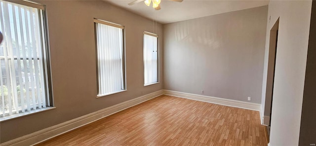 unfurnished room with ceiling fan and light wood-type flooring