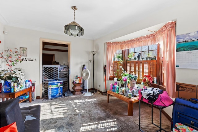 sitting room featuring crown molding and carpet floors