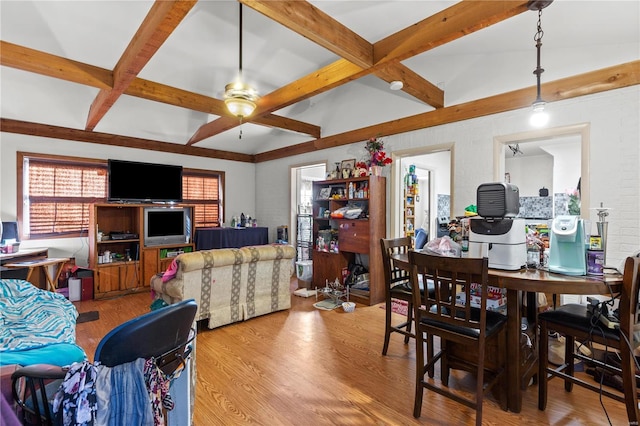 dining area featuring vaulted ceiling with beams, ceiling fan, and light hardwood / wood-style floors