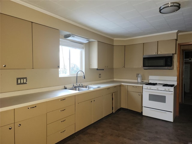 kitchen featuring white range with gas cooktop, crown molding, sink, and cream cabinetry