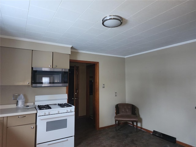 kitchen featuring crown molding and white gas stove