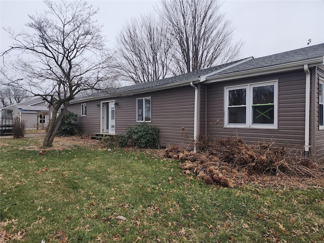 view of home's exterior featuring a lawn