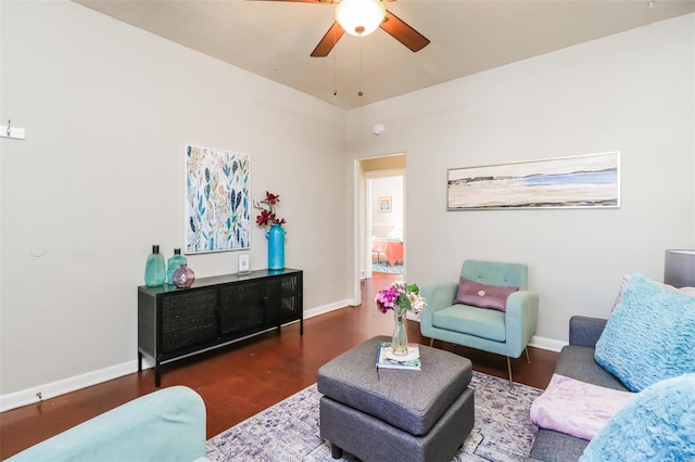 living room featuring dark hardwood / wood-style flooring and ceiling fan